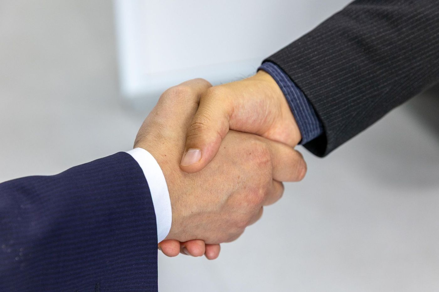 Two executives shaking hands